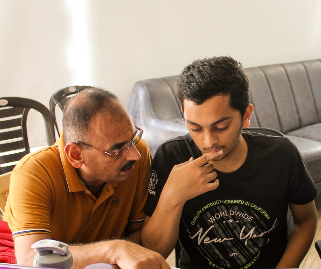 Parent explaing and helping for studying for neet